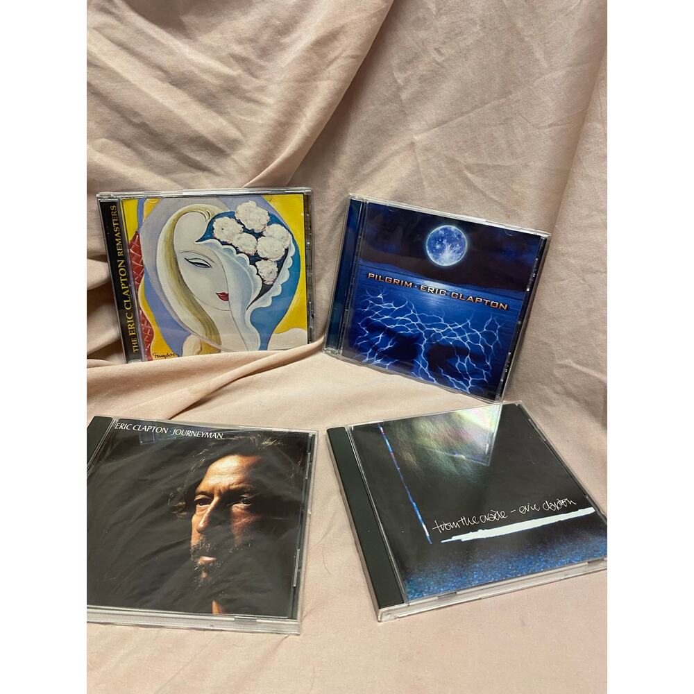 Lot Of 4 Eric Clapton CDs: Pilgrim, Journeyman, From The Cradle, And LAYLA
